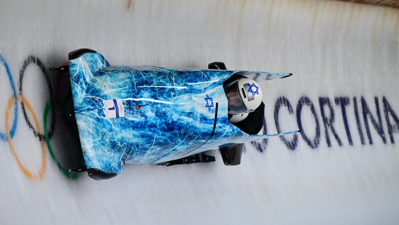 Israel’s AJ Edelman pilots in the bobsleigh men’s two-man training Heat 4 at Cortina Sliding Centre during the Milano Cortina 2026 Winter Olympic Games in Cortina d’Ampezzo on Feb. 13, 2026.