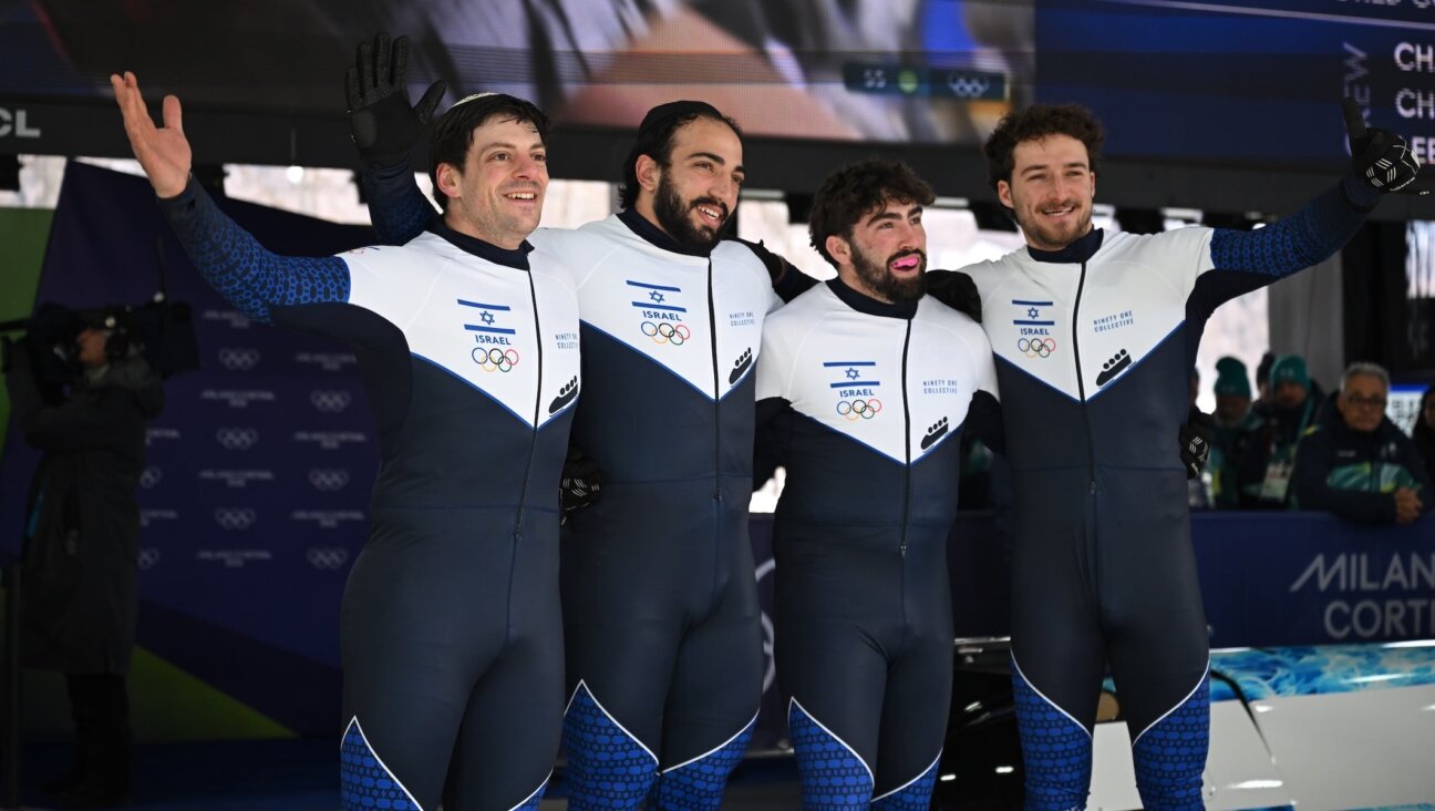 AJ Edelman, Menachem Chen, Uri Zisman and Omer Katz after completing the second run of the four-man bobsled competition at the 2026 Winter Olympics, Feb. 21, 2026, in Cortina, Italy.