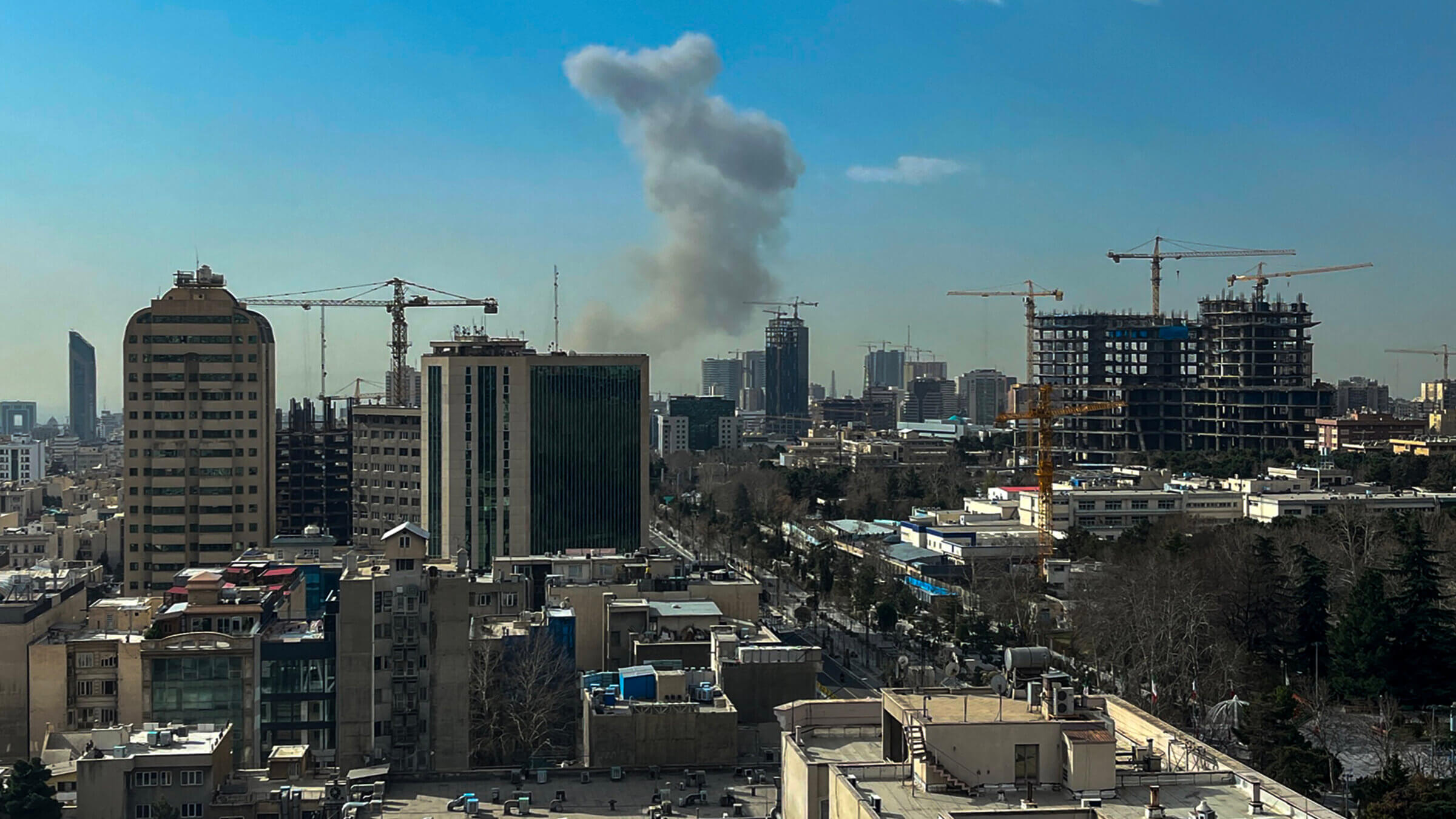 A plume of smoke rises following a reported explosion in Tehran on February 28, 2026. Israel's defence ministry announced February 28 it had launched a "preemptive strike" on Iran as sirens sounded in Jerusalem and people across the country received phone alerts about an "extremely serious" threat. (Photo by AFP via Getty Images)