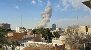 A plume of smoke rises after an explosion on Feb. 28, 2026 in Tehran as U.S. and Israeli forces launch a strike on Iran.(Majid Saeedi/Getty Images)