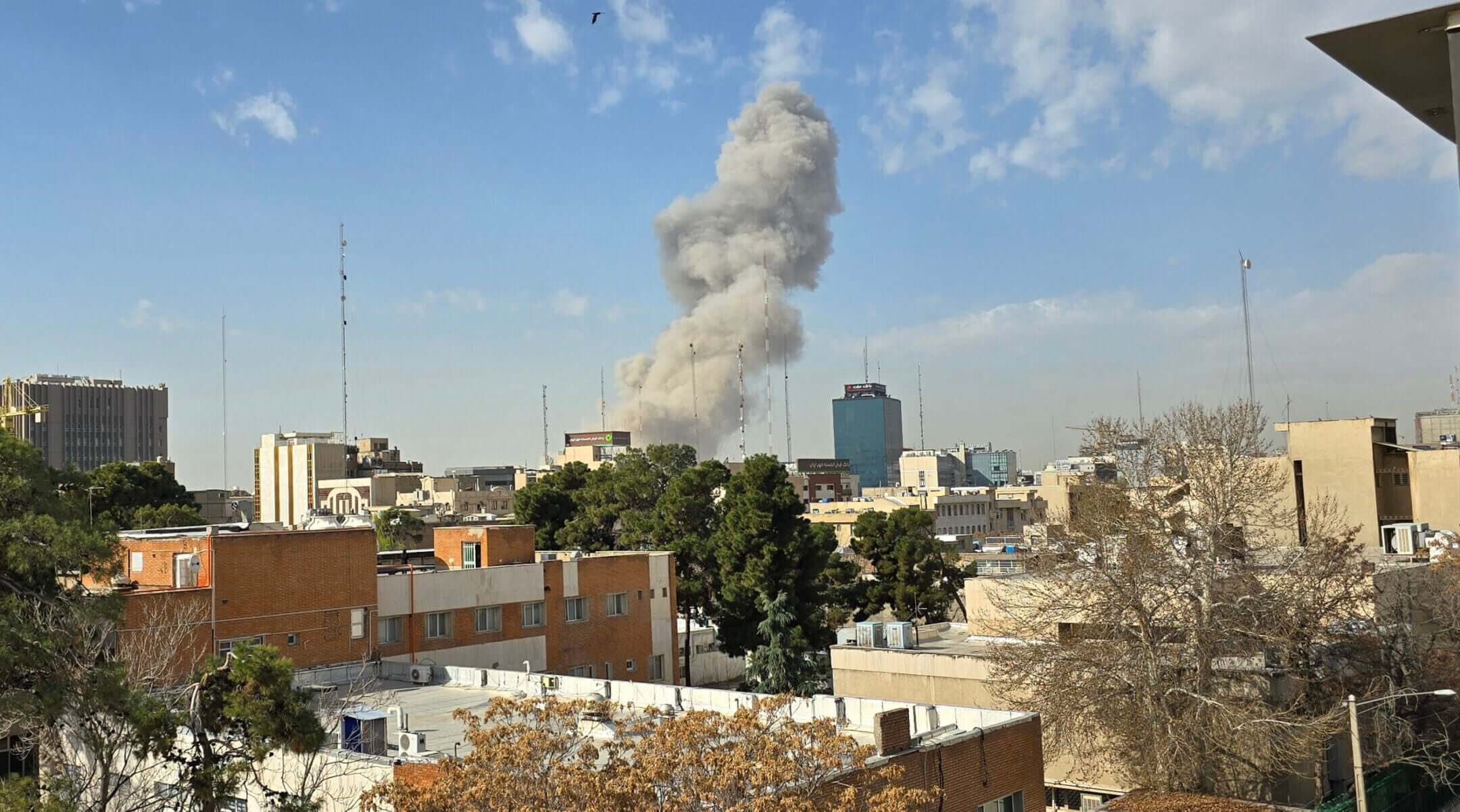 A plume of smoke rises after an explosion on Feb. 28, 2026 in Tehran as U.S. and Israeli forces launch a strike on Iran.(Majid Saeedi/Getty Images)