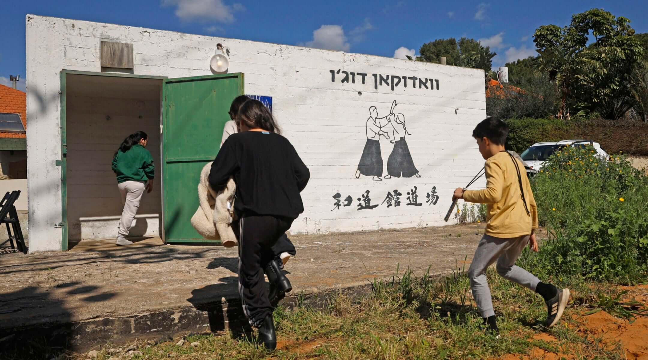 Israelis race for shelter amid reports of incoming missiles from Iran on Feb. 28, 2026 in Pardes Hanna-Karkur, Israel. 