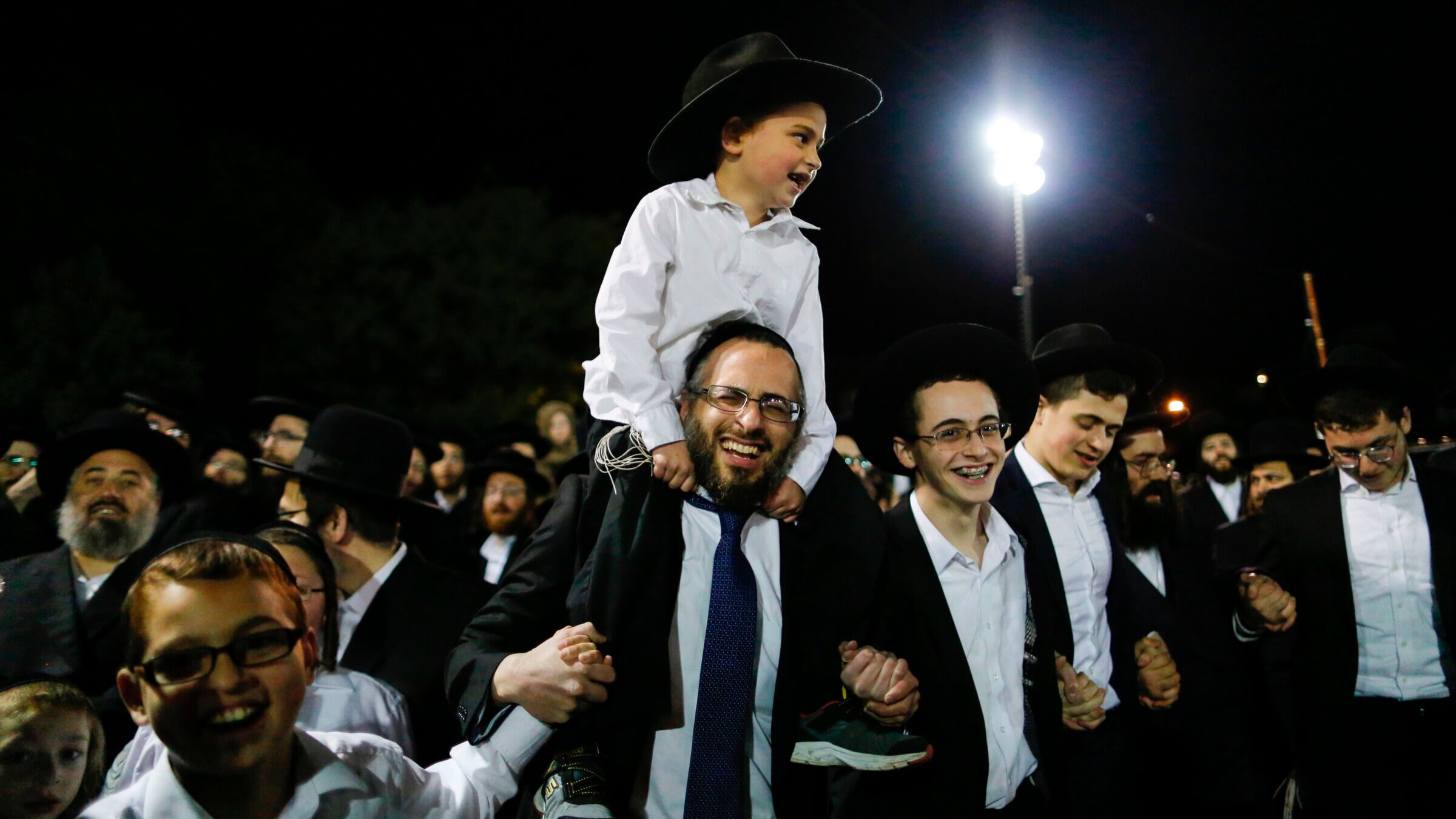 Orthodox Jews in the village of Kiryas Joel, New York, May 14, 2017, during celebrations for the Jewish holiday of Lag BaOmer, marking the anniversary of the death of Talmudic sage Rabbi Shimon Bar Yochai approximately 1,900 years ago.