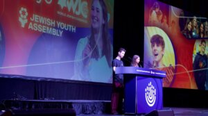 Leo Coen and Raquel Rogoff present the Jewish Youth Assembly resolution at the BBYO International Convention on Feb. 14, 2026.