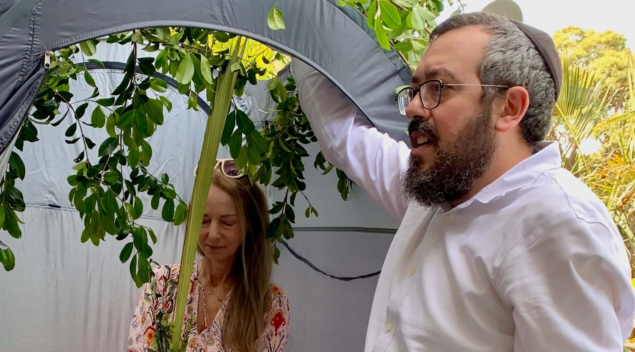 Nikki Goldstein and Rabbi Eli Schlanger celebrate Sukkot. 