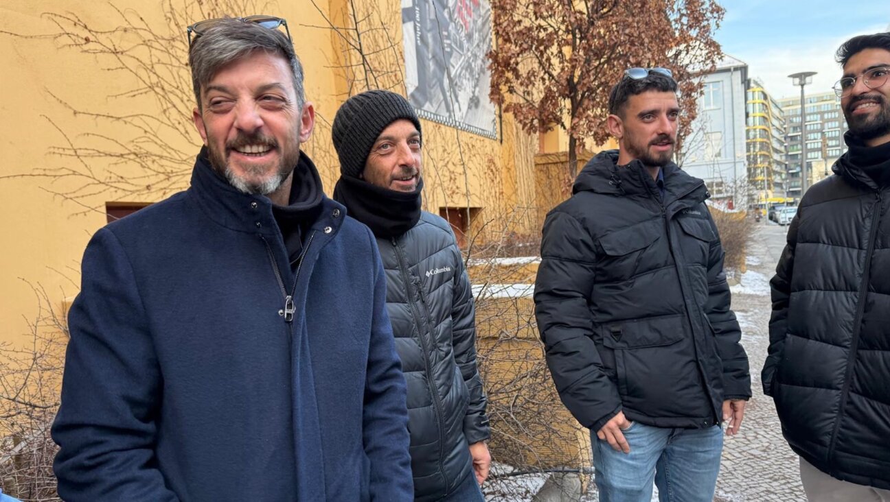Brothers David, Eitan and Ariel Cunio, from left, stand outside the Berlin theater Babylon before a screening of a documentary about their family, Feb. 20, 2026.