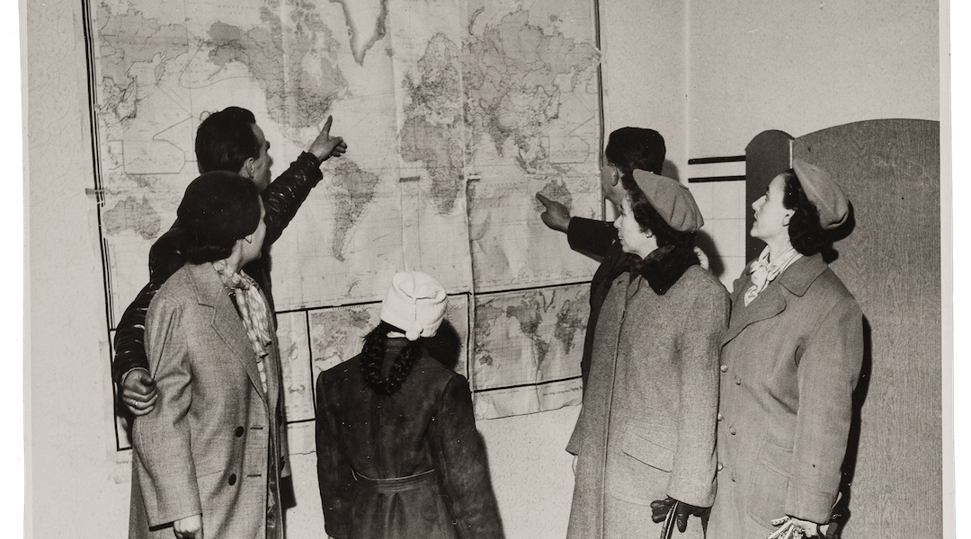 Refugees from Hungary gather in the HIAS Vienna office, some expressing a desire to immigrate to the United States, and others to Australia, where they have relatives.