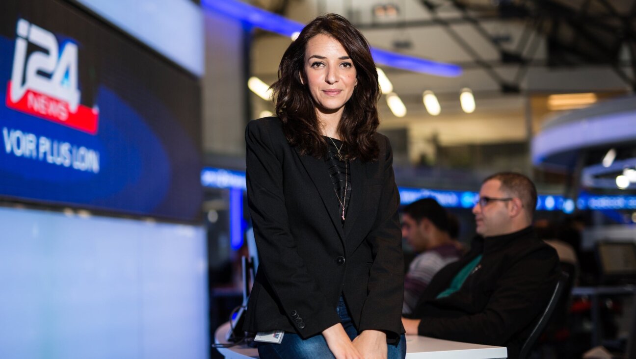 Israeli-Arab news anchor and prime time manager on i24news channel Lucy Aharish, poses for a portrait at the i24news studios, on April 15, 2015 in Jaffa, Israel. 