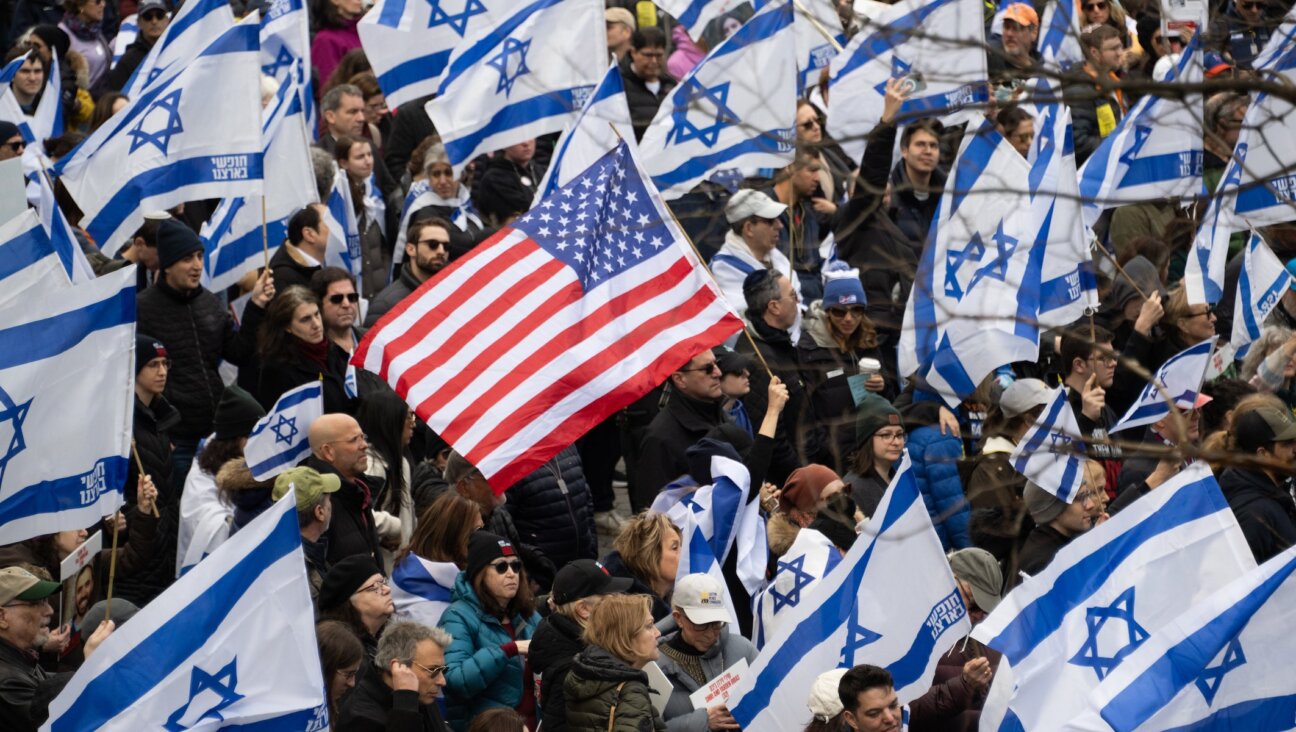Demonstrators hold US and Israeli flags during a rally in Central Park marking 150 days since hostages were taken in attack on Israel on March 10, 2024 in New York City. (Noam Galai/Getty Images)