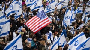 Demonstrators hold US and Israeli flags during a rally in Central Park marking 150 days since hostages were taken in attack on Israel on March 10, 2024 in New York City. (Noam Galai/Getty Images)