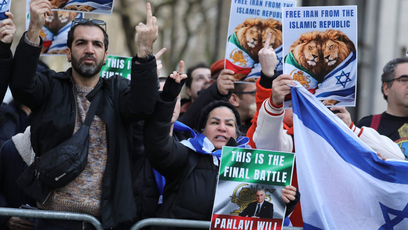 Protesters display Israeli flags along with placards stating "Free Iran from the Islamic Republic" in London on Jan. 31.