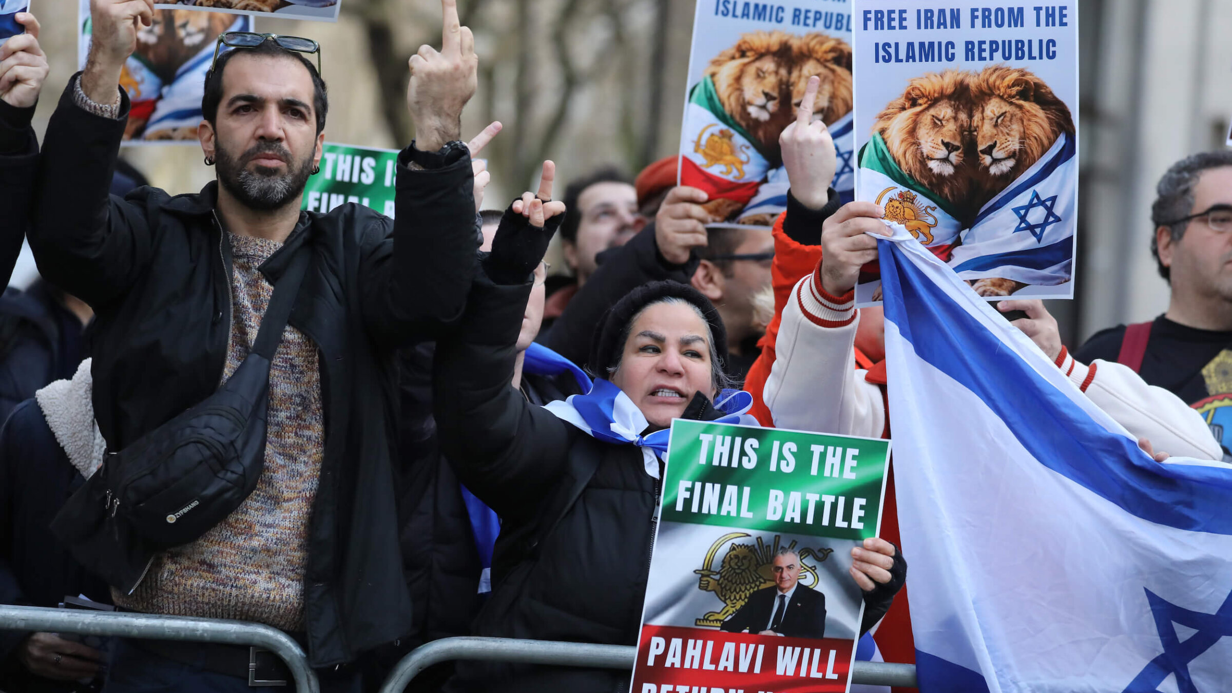 Protesters display Israeli flags along with placards stating "Free Iran from the Islamic Republic" in London on Jan. 31.