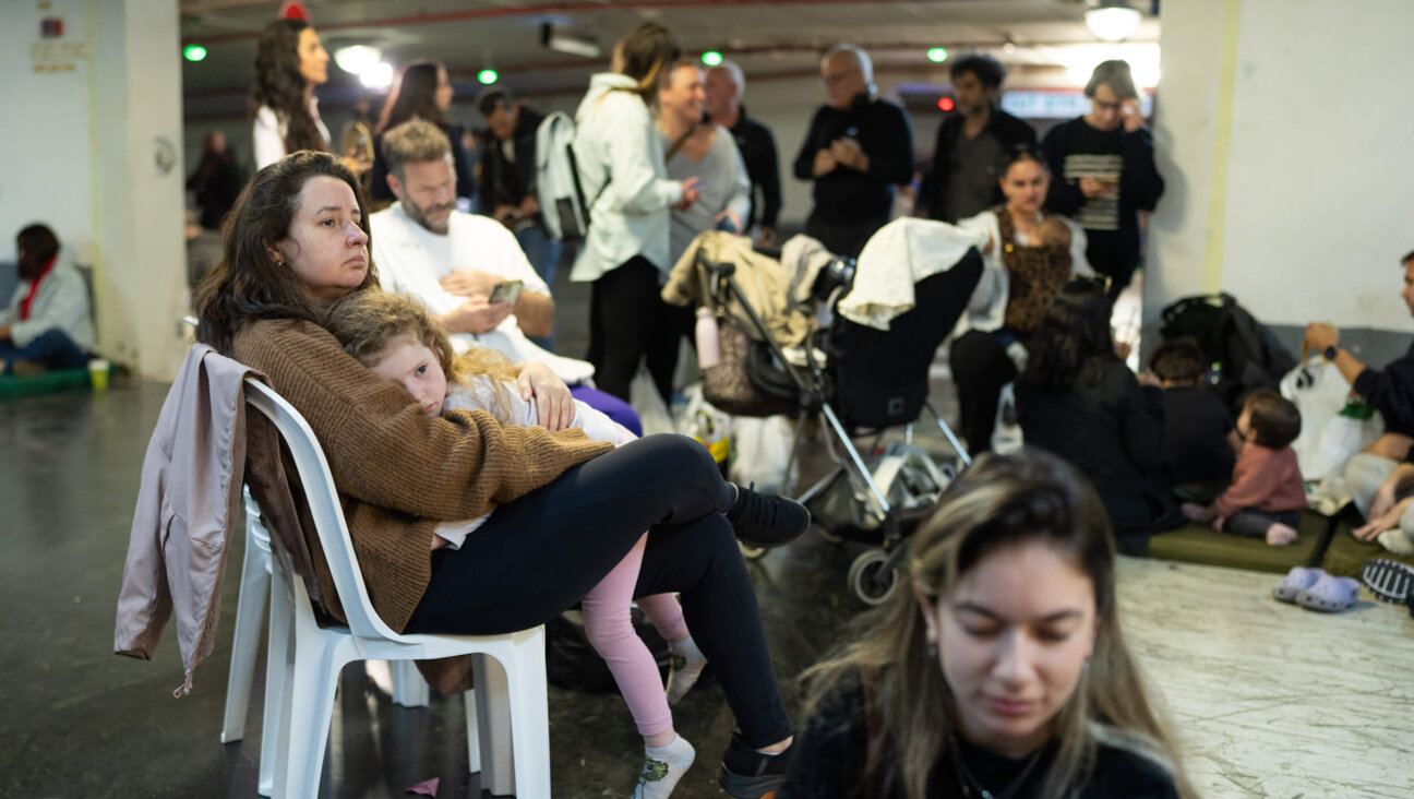 People take shelter in a parking garage in Tel Aviv, Israel amid reports of incoming missiles on Feb. 28. The country's Defense Minister Israel Katz declared a state of emergency this morning after Israel and the U.S. launched joint strikes on Iran, prompting Iran to launch a wave of missiles at Israel.