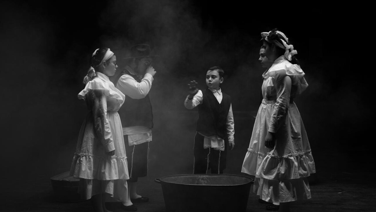 A scene in the Yiddish play "Shema Yisroel," staged in Tabisili in 2023