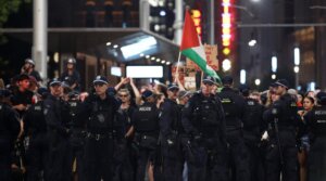 NSW Police surround protesters on George Street during a rally against the visit of Israel’s President Isaac Herzog on Feb. 9, 2026 in Sydney, Australia. (Lisa Maree Williams/Getty Images)