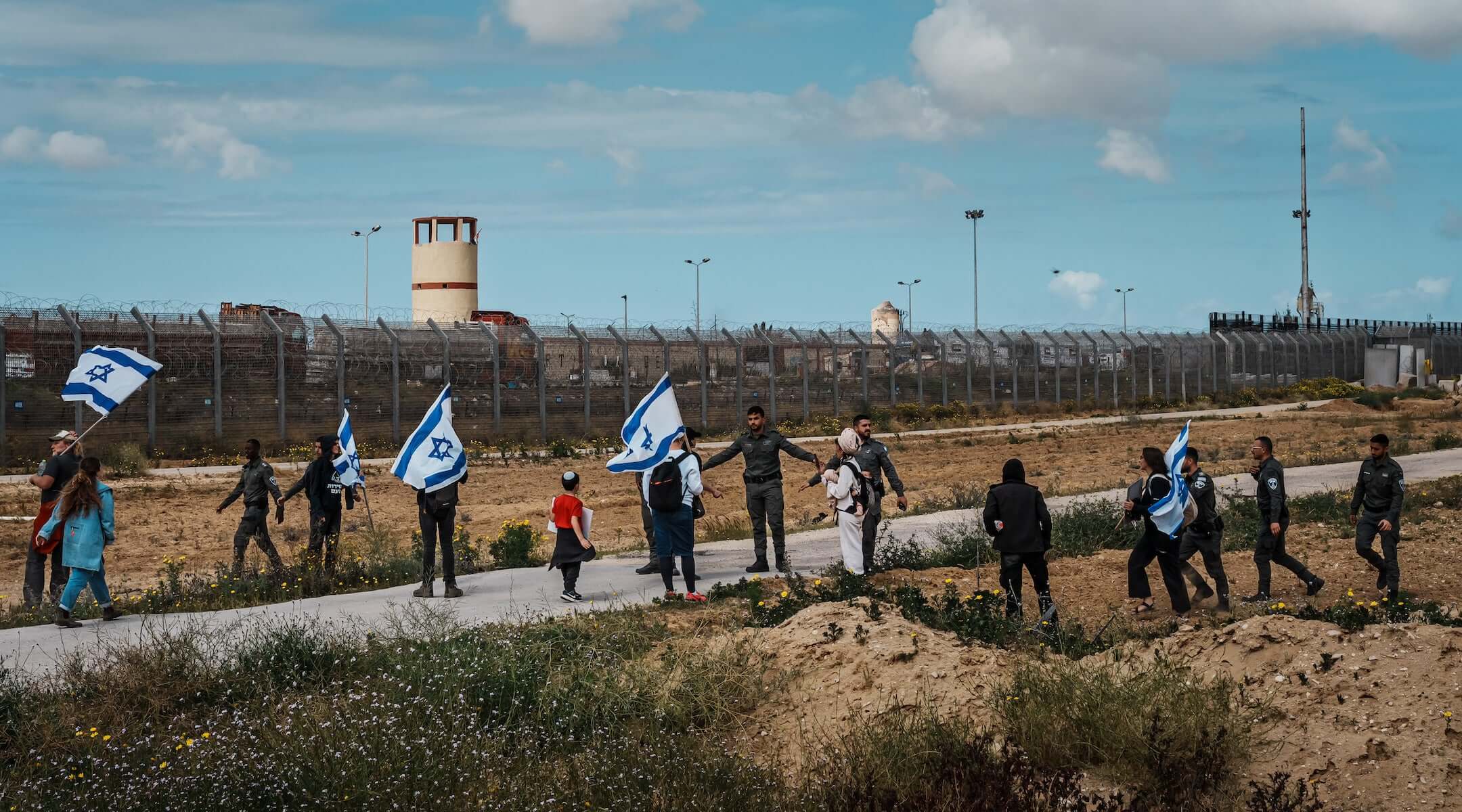 Israeli security forces prevent protesters from Tsav 9, or known as Order 9 movement, from crossing the border checkpoint with the goal of blocking aid shipments from getting into the Gaza, in Kerem Shalom, Israel, Thursday, March 7, 2024. (MARCUS YAM / LOS ANGELES TIMES)