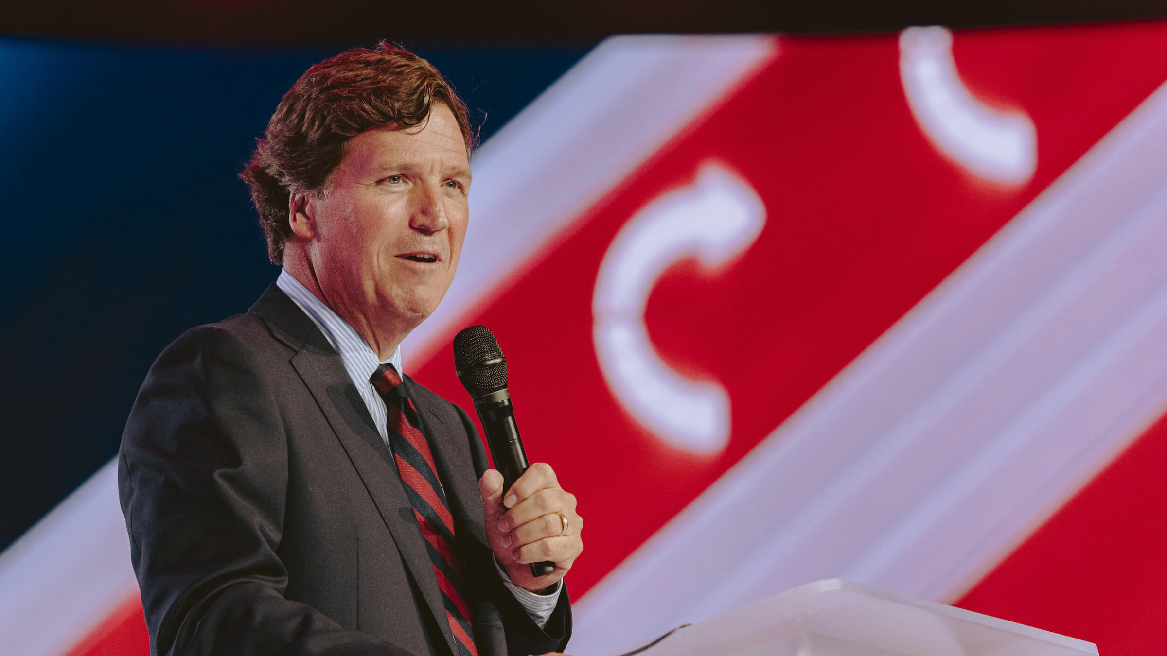 Conservative political commentator and podcast host Tucker Carlson speaks at Turning Point's annual AmericaFest conference in Phoenix, Arizona on Dec. 18, 2025.