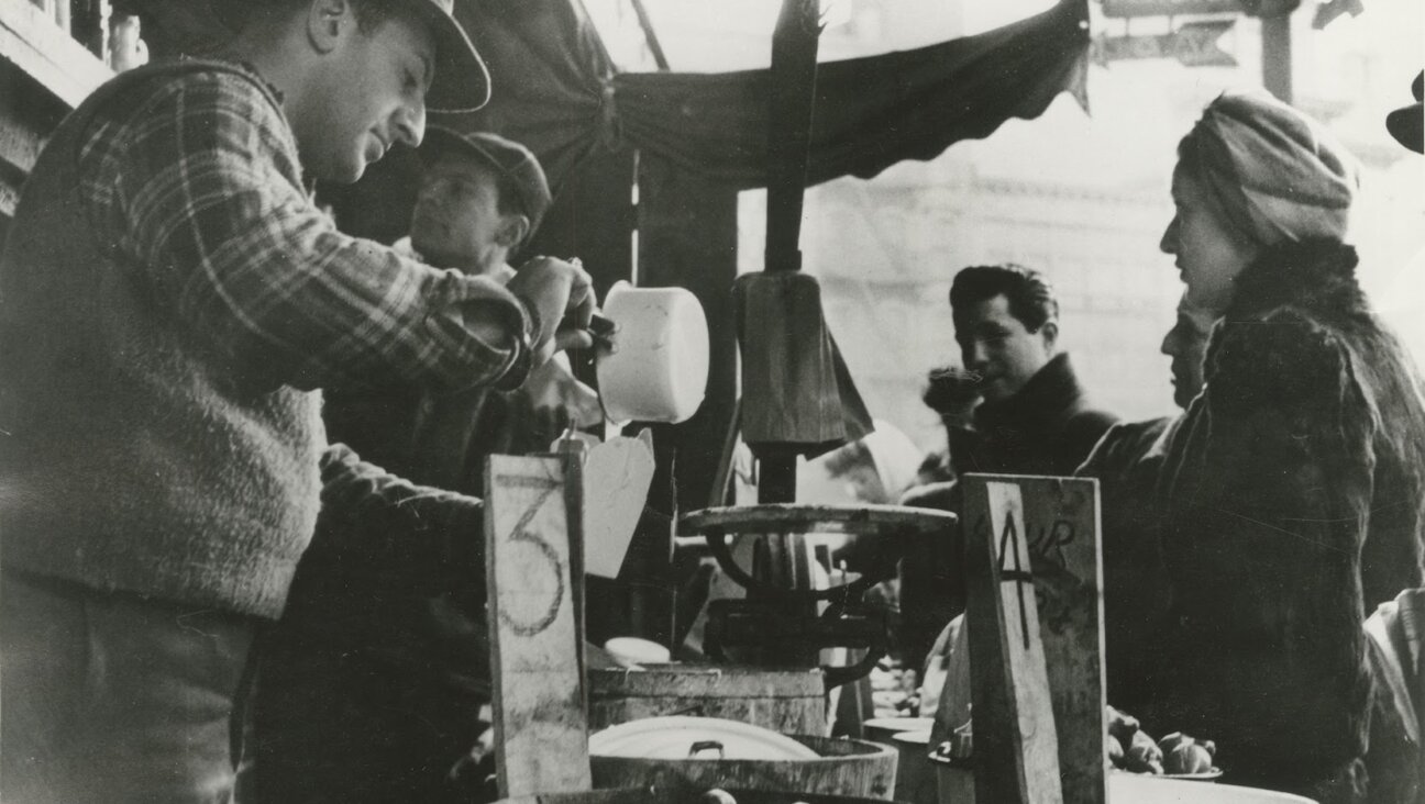 A Lower East Side pickle man serves customers. 