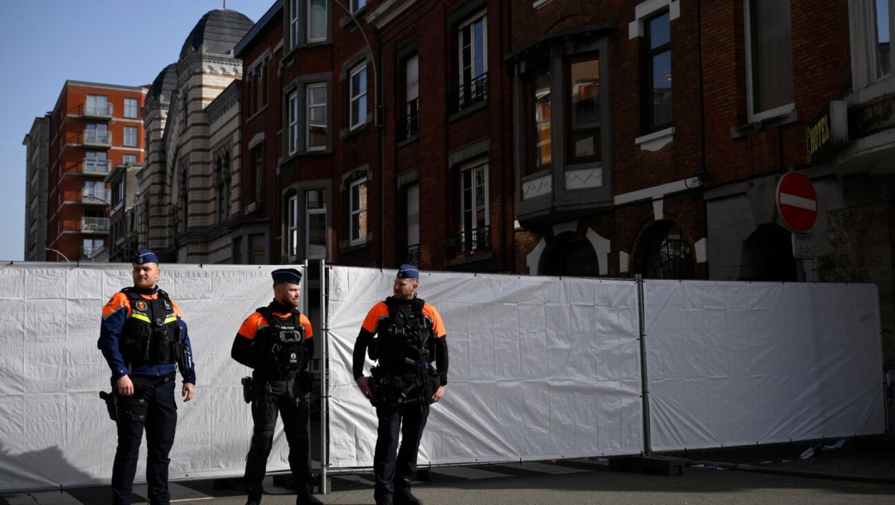 Police stand guard outside a synagogue in Liège, Belgium that was the site of an explosion March 9. (John Thys / AFP via Getty Images)