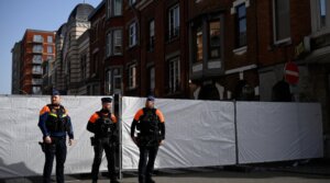 Police stand guard outside a synagogue in Liège, Belgium that was the site of an explosion March 9. (John Thys / AFP via Getty Images)