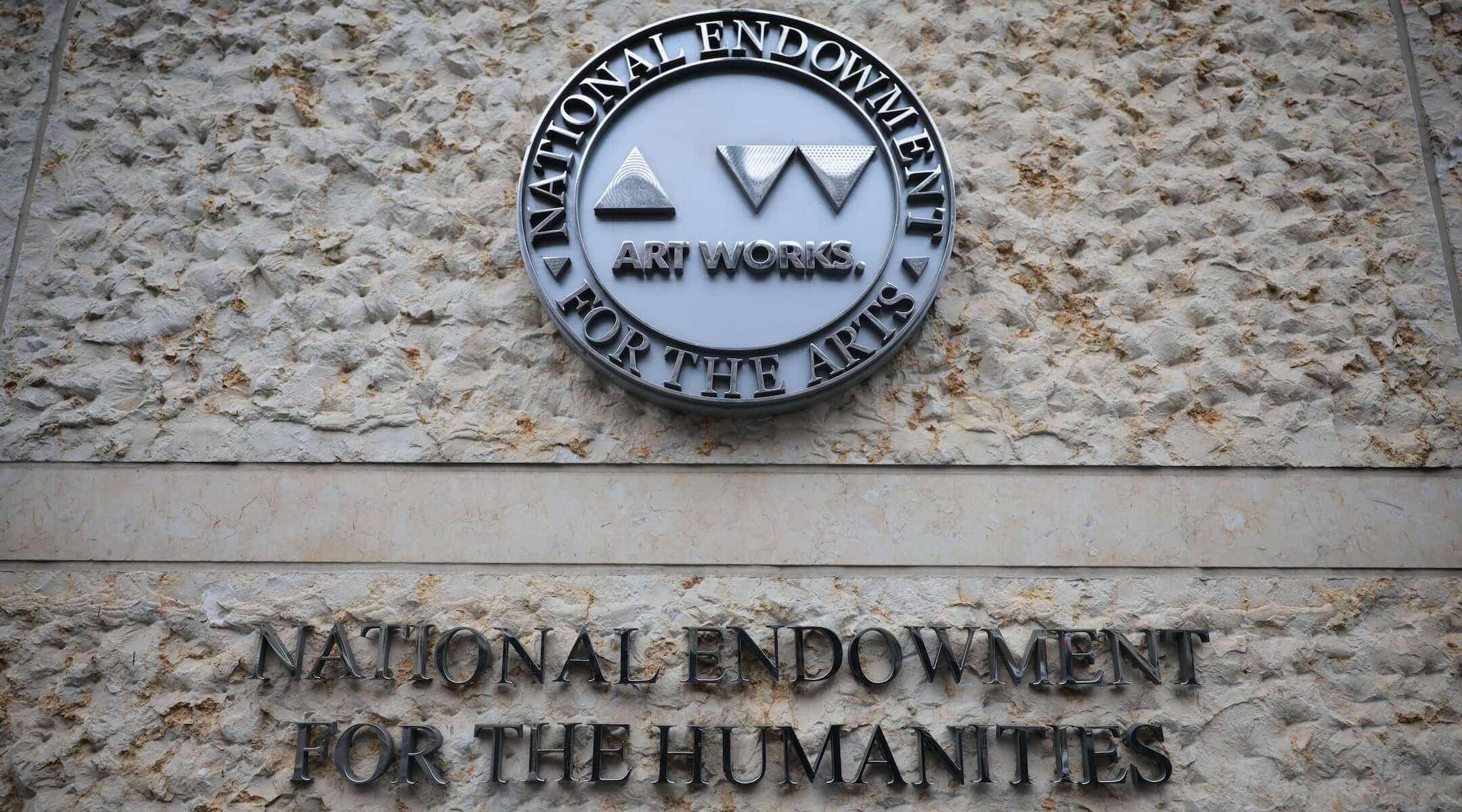 Rain falls on the National Endowment for the Humanities building (NEH) on April 11, 2025 in Washington, DC. The NEH has begun laying off staff after President Donald Trump and the Department of Government Efficiency’s (DOGE) February 11 executive order to reduce the federal workforce.
