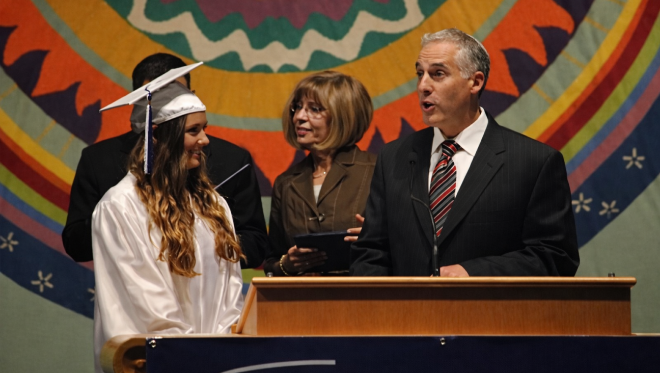 The author, left, with Temple Israel rabbi Josh Bennett, at her graduation from Frankel Jewish Academy in 2011.