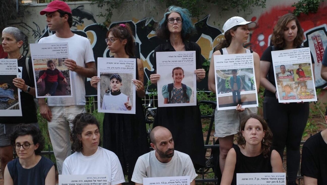 Silent protesters in Israel hold signs of Palestinian children killed by the IDF in the Oscar-nominated short 'Children No More.'