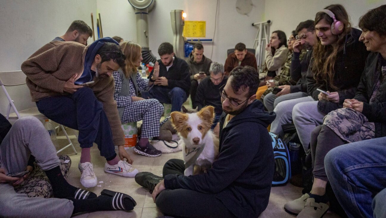 Israelis take cover in a public shelter in Tel Aviv as a siren sounds warning of incoming ballistic missiles fired from Iran toward Israel, March 1, 2026.