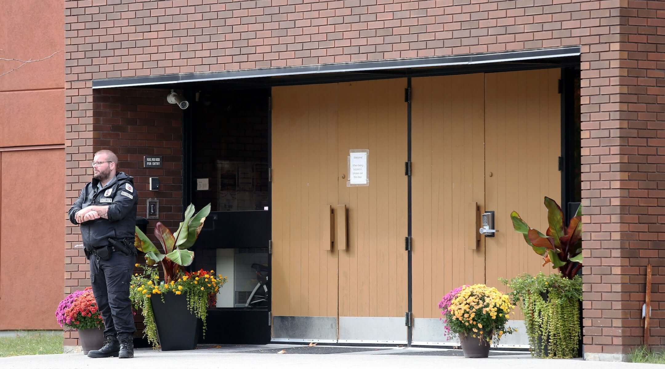 A security guard stands outside the front door of Machzikei Hadas Orthodox synagogue on Oct. 8, 2023, Ottawa, Ontario, Canada.