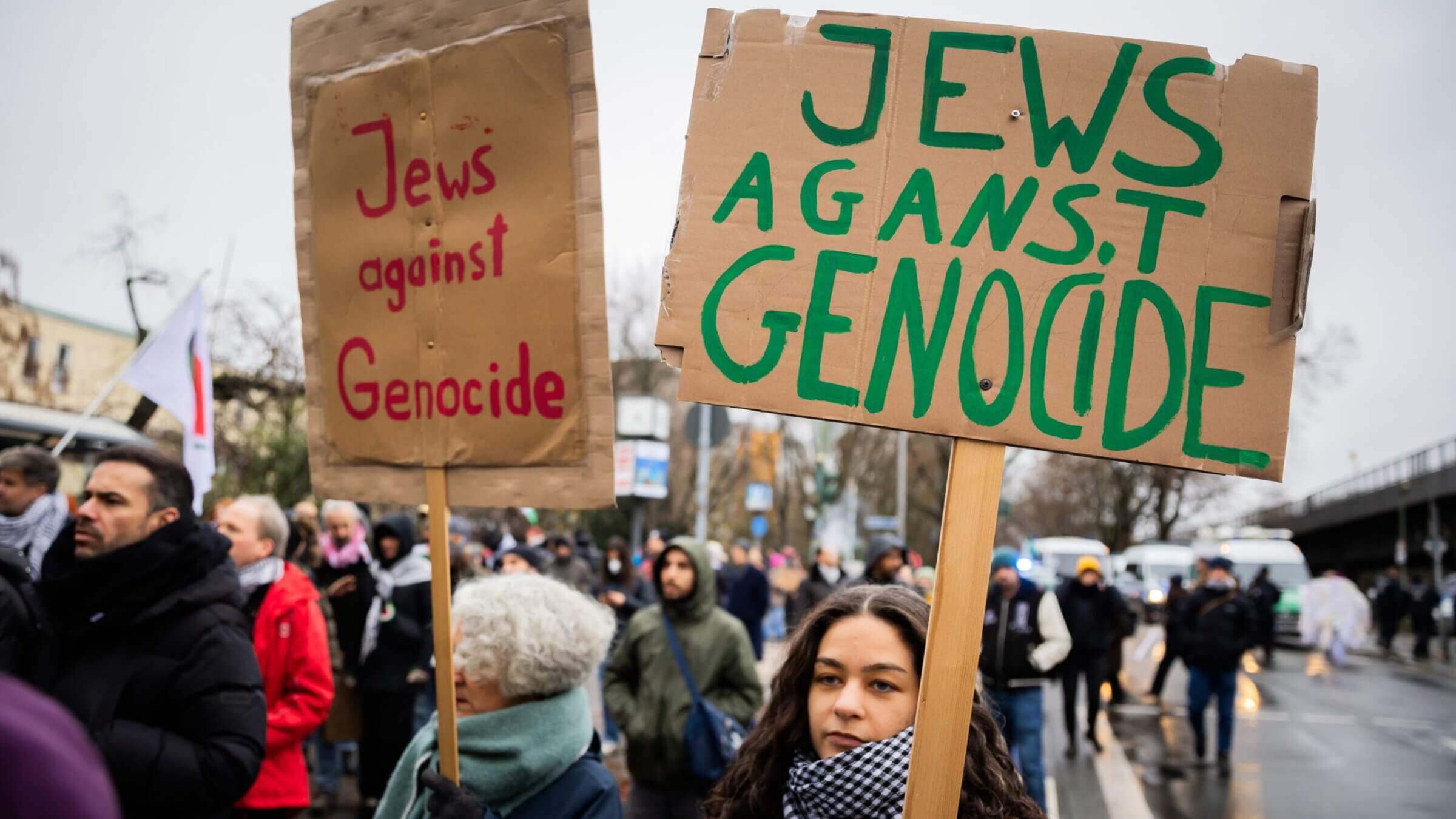 'Jews against genocide' is written on posters at a demonstration of several hundred people in Berlin, Dec. 23, 2023.