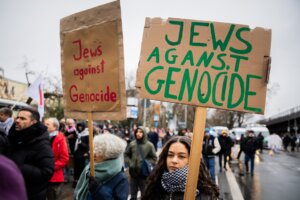'Jews against genocide' is written on posters at a demonstration of several hundred people in Berlin, Dec. 23, 2023.