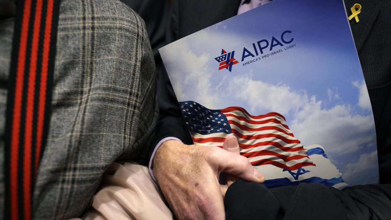 A visitor holds an AIPAC folder in an elevator in Rayburn House Office Building on March 12, 2024 on Capitol Hill in Washington, DC.