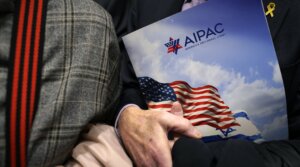 A visitor holds an AIPAC folder in an elevator in Rayburn House Office Building on March 12, 2024 on Capitol Hill in Washington, DC.
