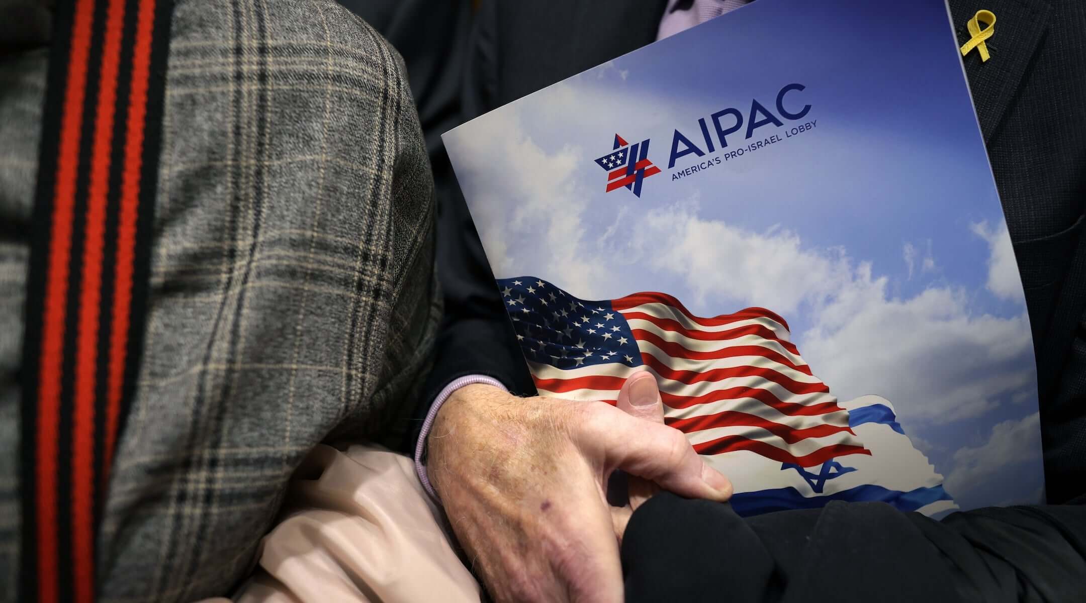 A visitor holds an AIPAC folder in an elevator in Rayburn House Office Building on March 12, 2024 on Capitol Hill in Washington, DC.