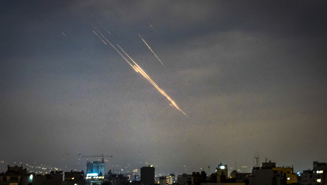 Iranian missiles and Israeli interceptive missiles over Beirut, Lebanon. The laser, had it been used, would have been invisible.