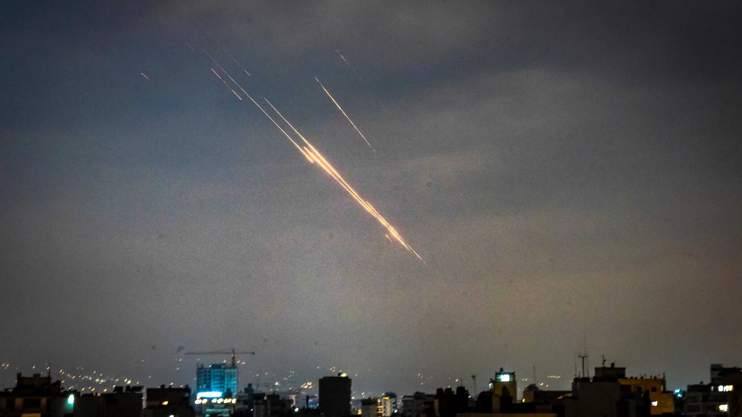 Iranian missiles and Israeli interceptive missiles over Beirut, Lebanon. The laser, had it been used, would have been invisible.