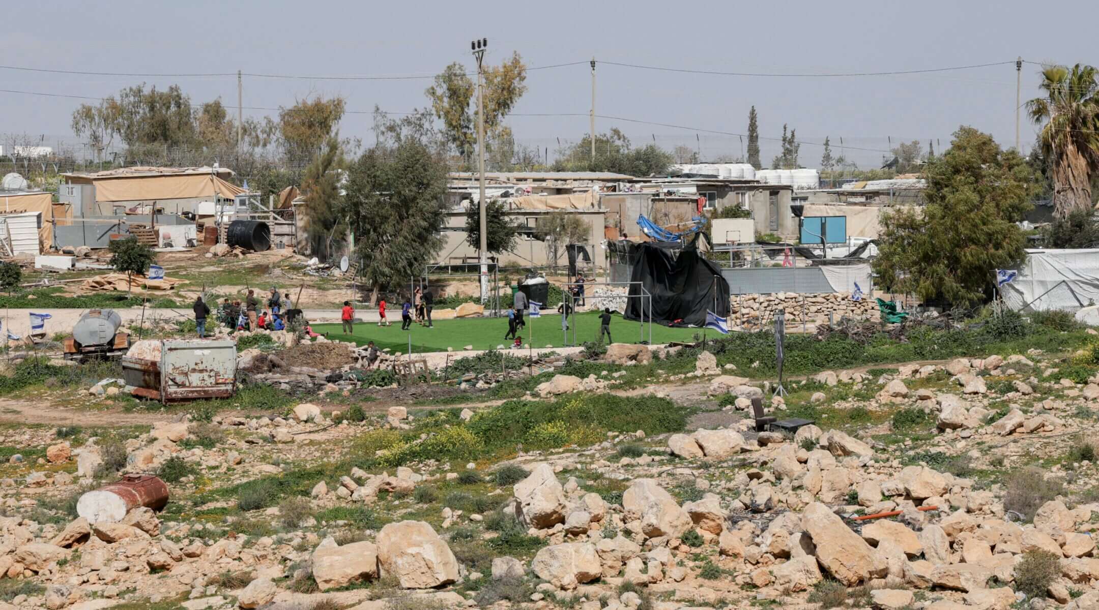 A general view shows the football field and surrounding homes in the village of Umm Al-Khair in Masafer Yatta, south of Hebron, West Bank on Feb. 12, 2026.