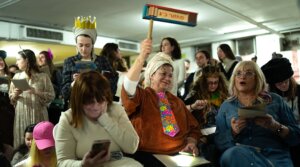 Israelis attend the reading of the Book of Esther in the Dizengoff Center underground parking lot to mark Purim in Tel Aviv, March 2, 2026. The garage served as a bomb shelter as Iran exchanged missiles with Israel.