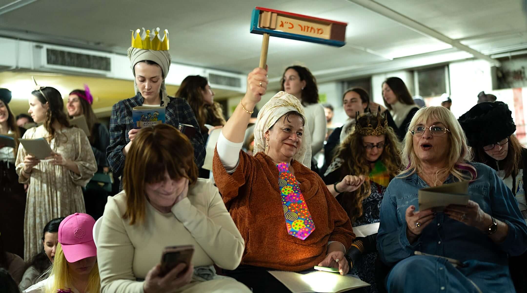 Israelis attend the reading of the Book of Esther in the Dizengoff Center underground parking lot to mark Purim in Tel Aviv, March 2, 2026. The garage served as a bomb shelter as Iran exchanged missiles with Israel.