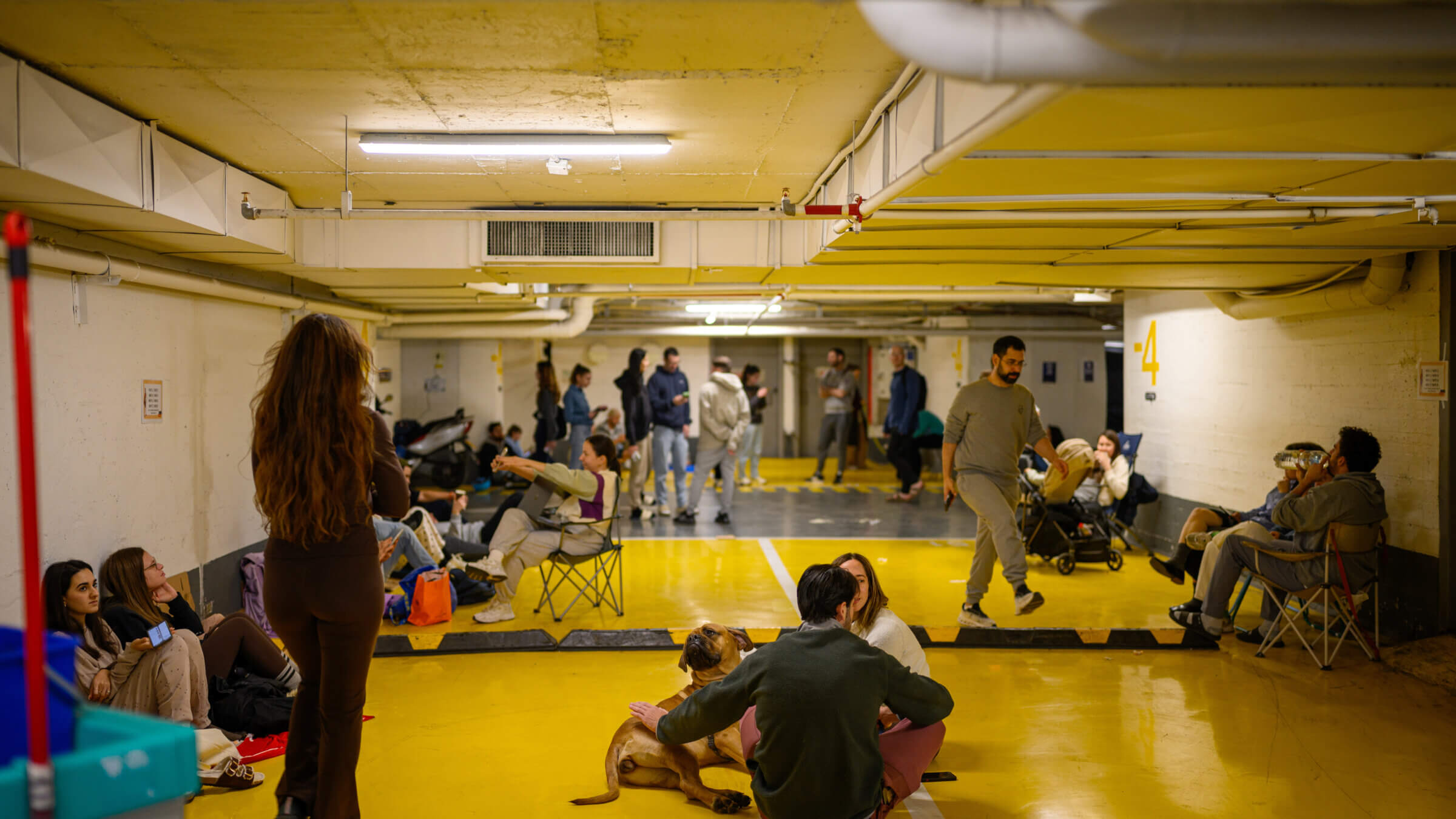 People take shelter in an underground bomb shelter amid reports of incoming missiles on Feb. 28, 2026 in Tel Aviv.