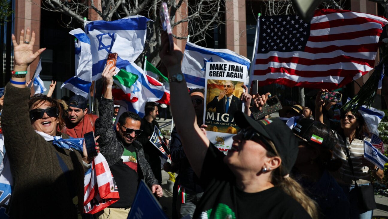 Iranian Americans wave flags and chant during a gathering of Iranian community members showing support for Israel and the United States, outside the Consulate General of Israel in Los Angeles, on March 5, 2026.