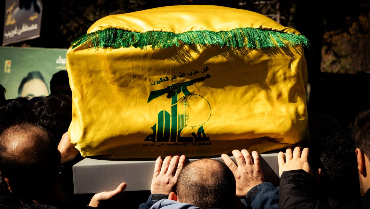 Men carry a coffin draped in a Hezbollah flag during a funeral of those killed in Israeli airstrikes in eastern Lebanon on March 5, 2026.