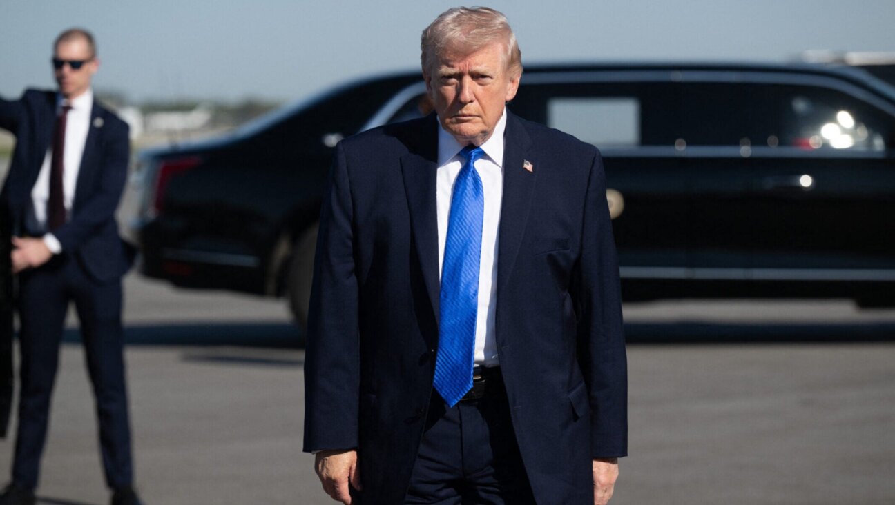 President Donald Trump speaks to reporters before boarding Air Force One at Palm Beach International Airport in West Palm Beach, Florida, on March 23, 2026.