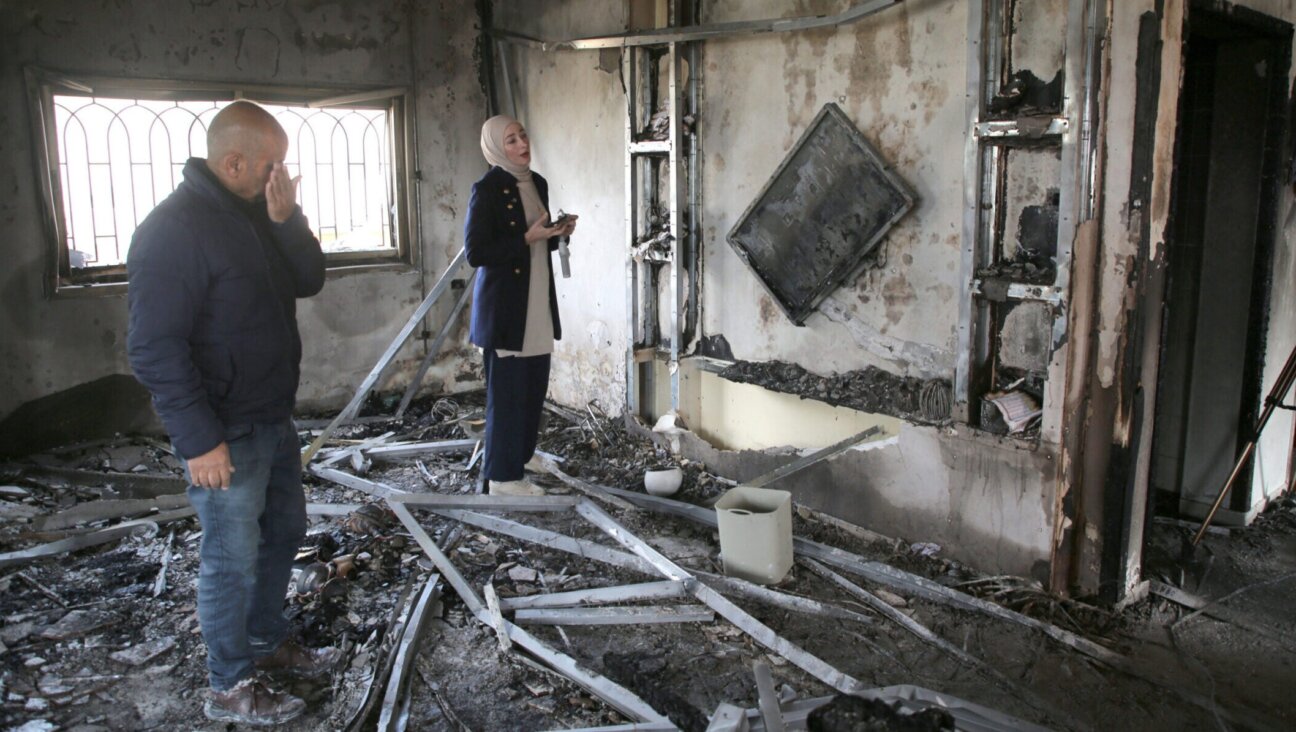 Palestinians inspect a burned-out house following an attack by Jewish settlers, in the West Bank, March 23, 2026. (Nasser Ishtayeh/SOPA Images/LightRocket via Getty Images)