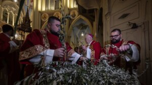 Christians attend a service organized by the Latin Patriarchate to celebrate the feast of Palm Sunday, one of the most important holidays of the Christian calendar, in Jerusalem, March 29, 2026.