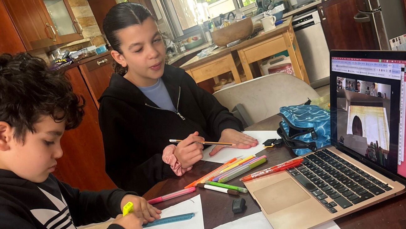 Claire Bloom Moradian’s children participate in a Zoom class while their school is closed during the war with Iran, March 2026. (Courtesy Moradian)
