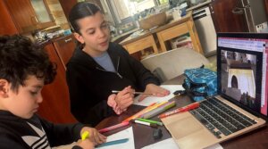 Claire Bloom Moradian’s children participate in a Zoom class while their school is closed during the war with Iran, March 2026. (Courtesy Moradian)