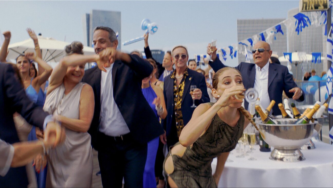 The raucous world of <i>Yes!</i> is unsparing in its satire of a country partying near the abyss.
