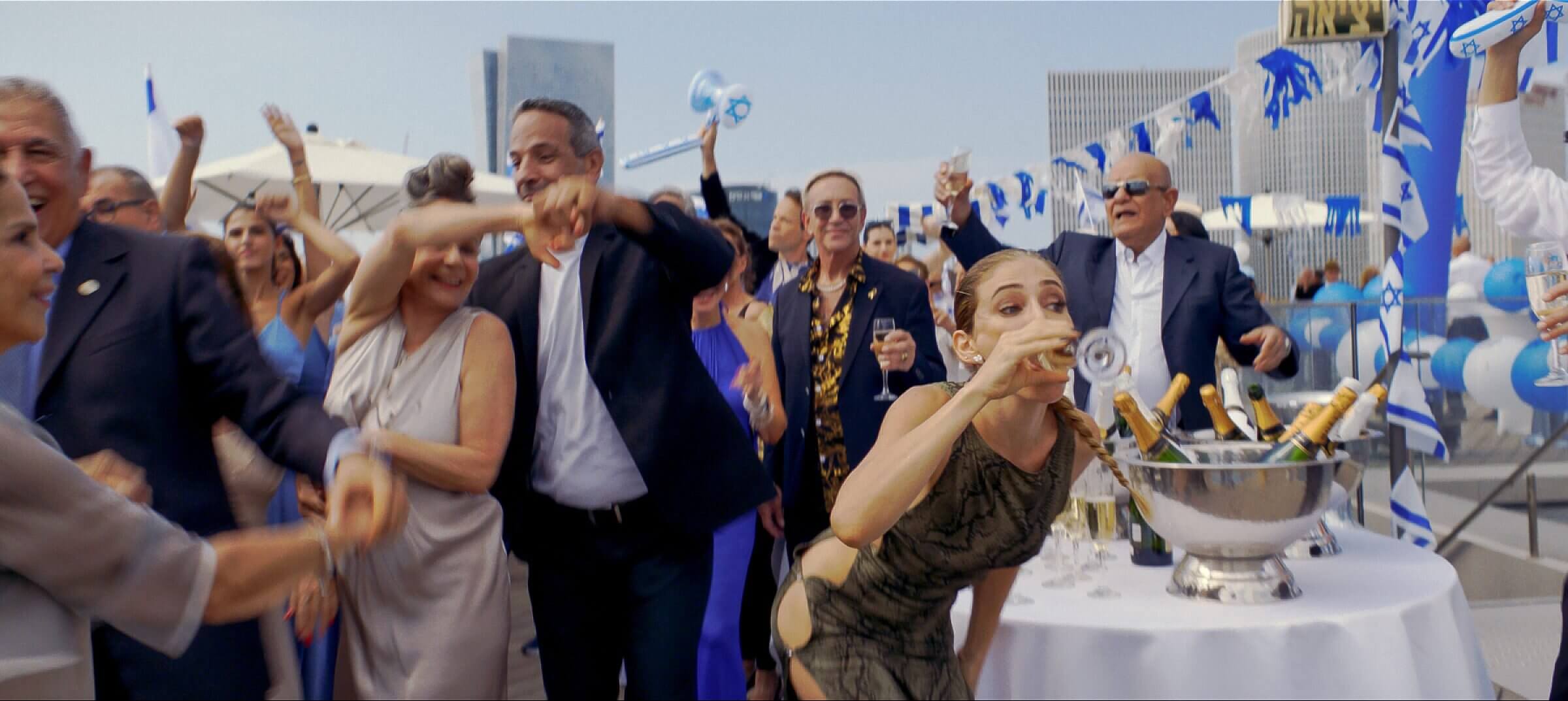 The raucous world of <i>Yes!</i> is unsparing in its satire of a country partying near the abyss.
