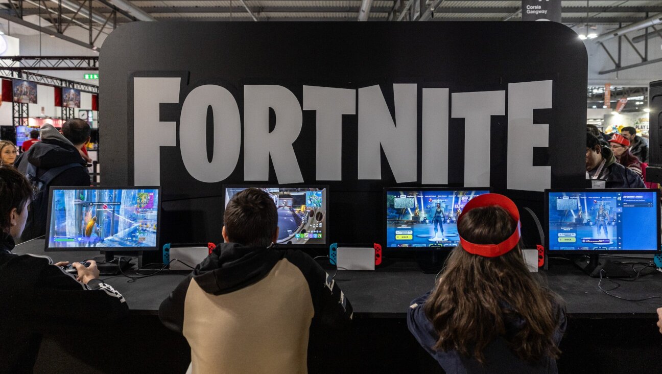 Fairgoers play video games at the Japanese publisher Nintendo Switch’s stand during Milan Games Week and Cartoomics 2024 at Fiera Milano Rho on November 22, 2024 in Milan, Italy. (Emanuele Cremaschi/Getty Images)